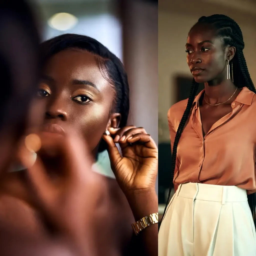 Close-up of a Black woman’s face and hands as she adjusts her earring in a mirror. She has a clean, "no-makeup" makeup look, glowing skin, and a neat, professional hairstyle. She is wearing a simple gold watch. The image focuses on poise and preparation.